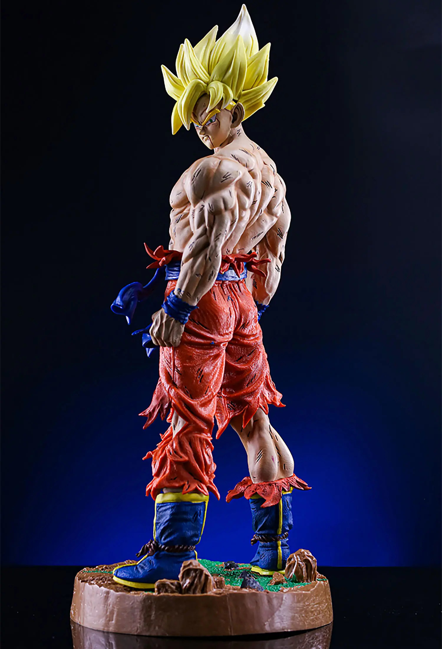 Buy Dragon Ball Z Goku Battle Damaged Looking Back Version Statue with Crypto at AnimeFigureHub